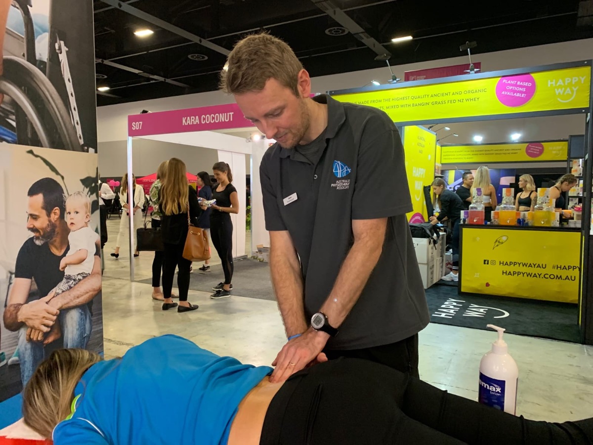 Jason Wheeler delivering hands-on physiotherapy treatment to a patient